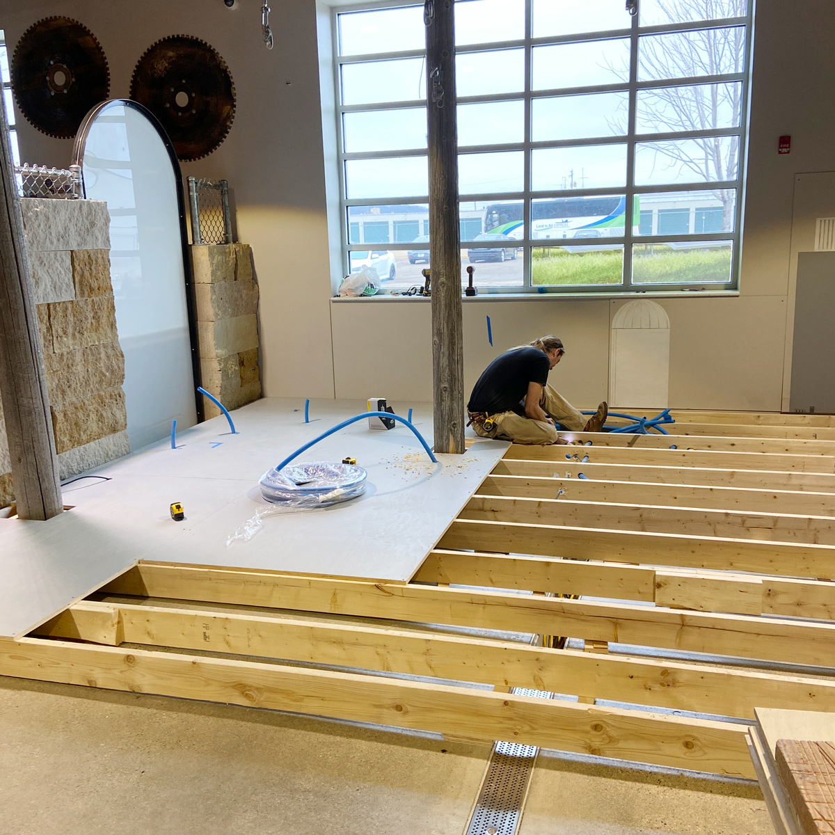 Luke installing the subfloor of The Grid
