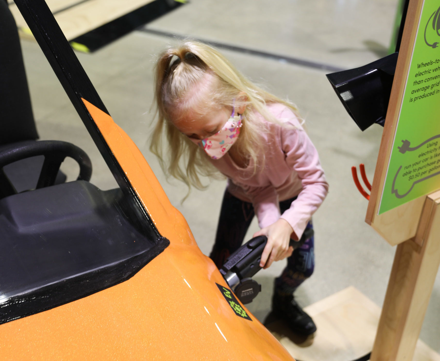Charging electric vehicle in the Energy: Powered by Play exhibit