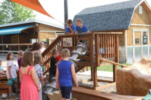 Water play activity in the H2GO Outdoor Water Gallery at the Childrens Museum of Southern Minnesota Mankato