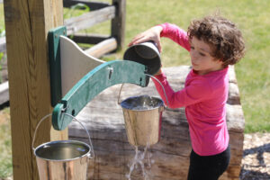 Water play in the H2GO Outdoor Water Gallery at the Childrens Museum of Southern Minnesota Mankato