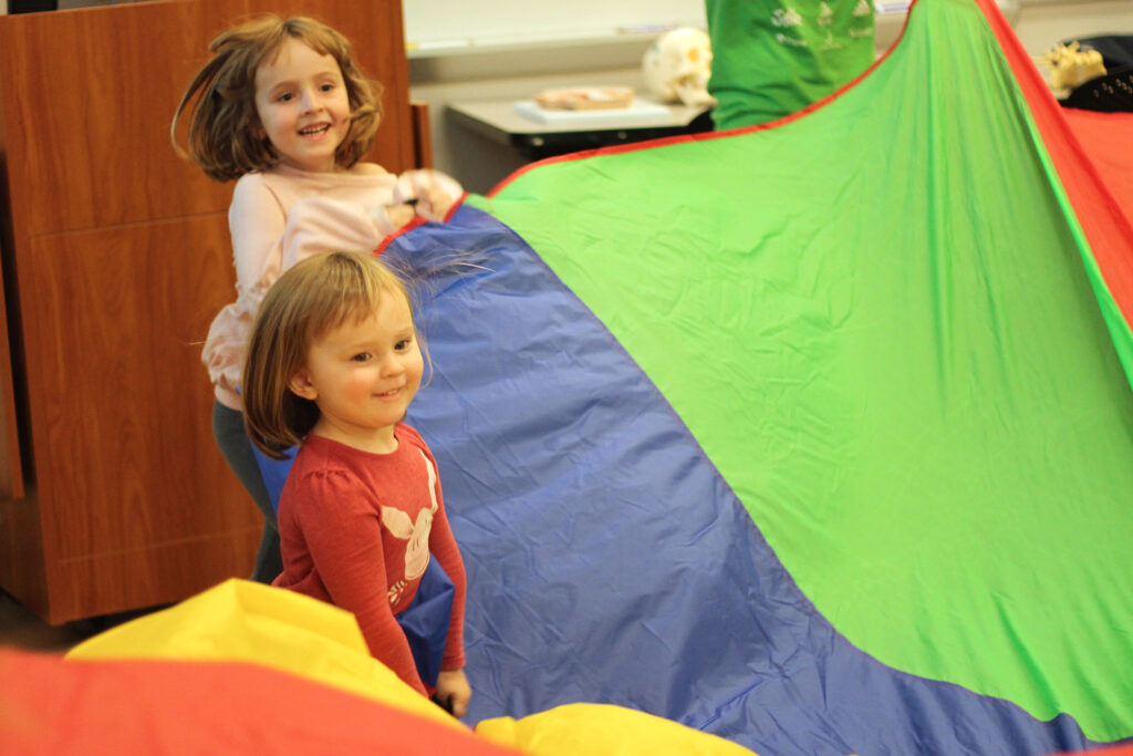 Exploring parachutes at the Children's Museum in Mankato