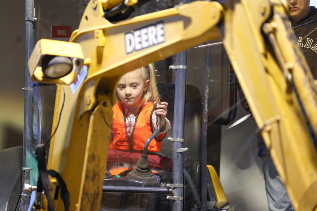 Operate a Mini Excavator at Dig It exhibit at the Childrens Museum of Southern Minnesota in Mankato