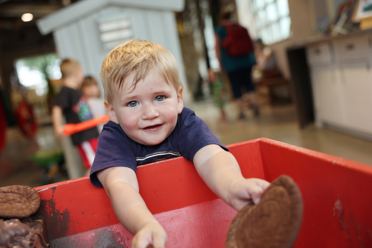 Child exploring agriculture in the Ag and Nature lab at the Childrens Museum in Mankato