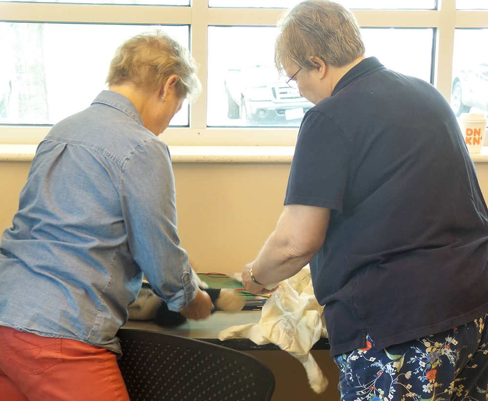 Sewing Group getting creative creating loose part toys at the Children's Museum in Mankato