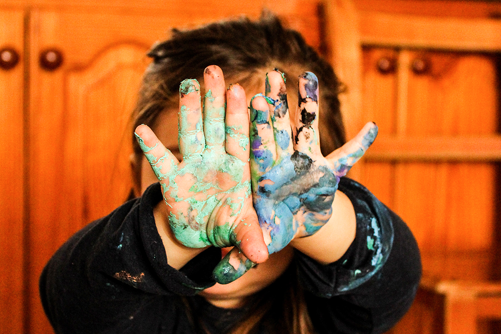 Painting is a good messy play activity for kids to do indoors
