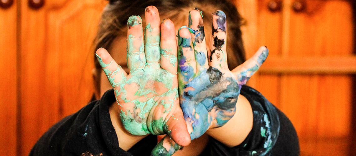 Painting is a good messy play activity for kids to do indoors